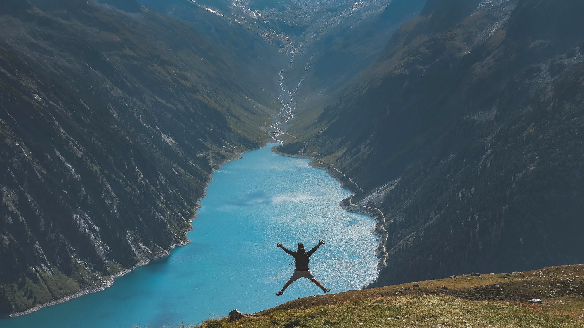 A bright blue lake between mountains