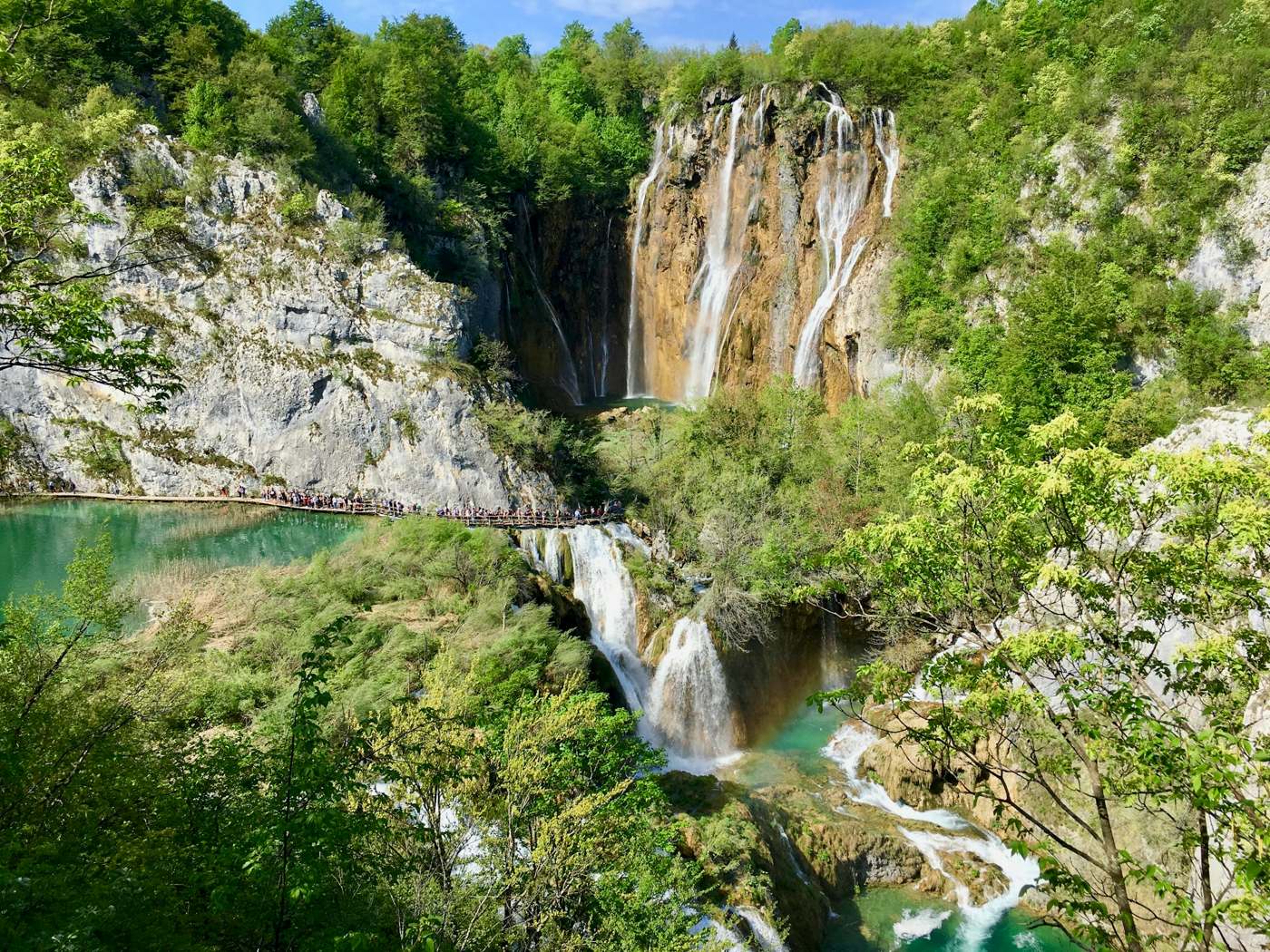 A waterfall surrounded by green forest